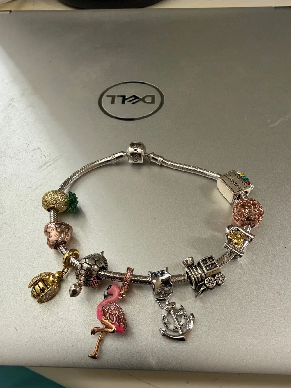 Stunning silver Pandora type 8” charm bracelet with 10 removable charms.